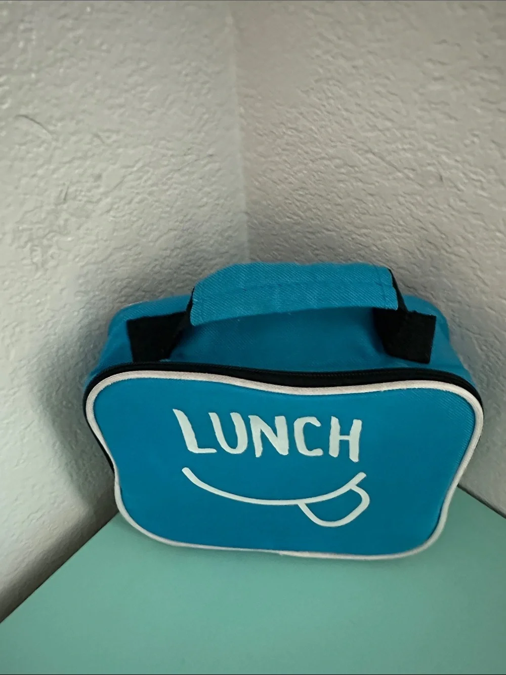 Walmart blue insulated lunch box with a minimalist white ’LUNCH’ graphic-used